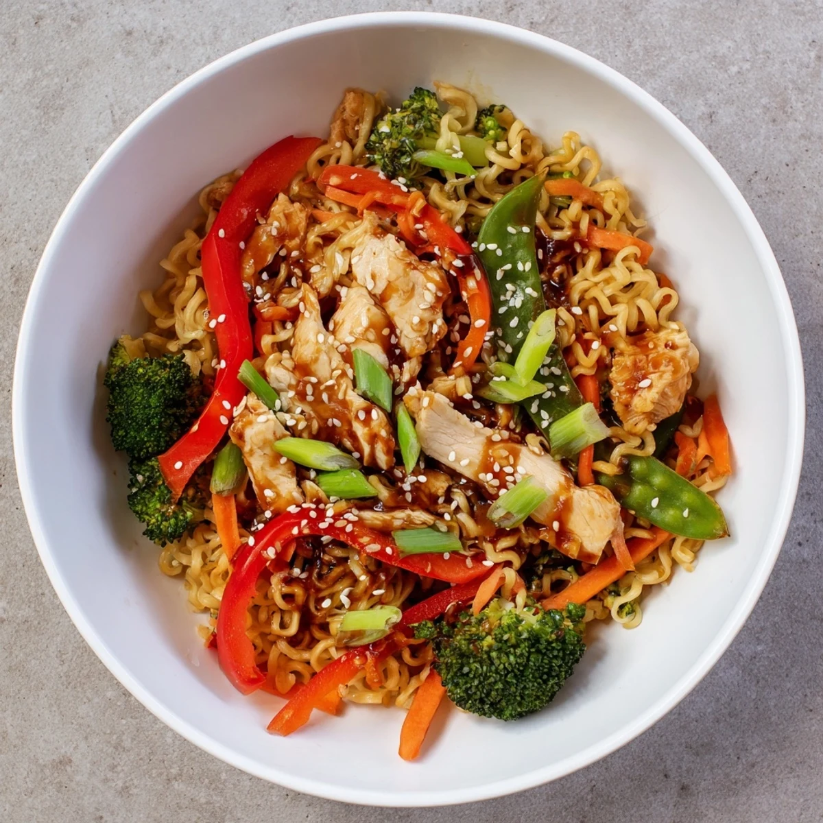 Imagine crispy, delicious sheet-pan ramen with vibrant veggies and tender chicken, ready to eat.