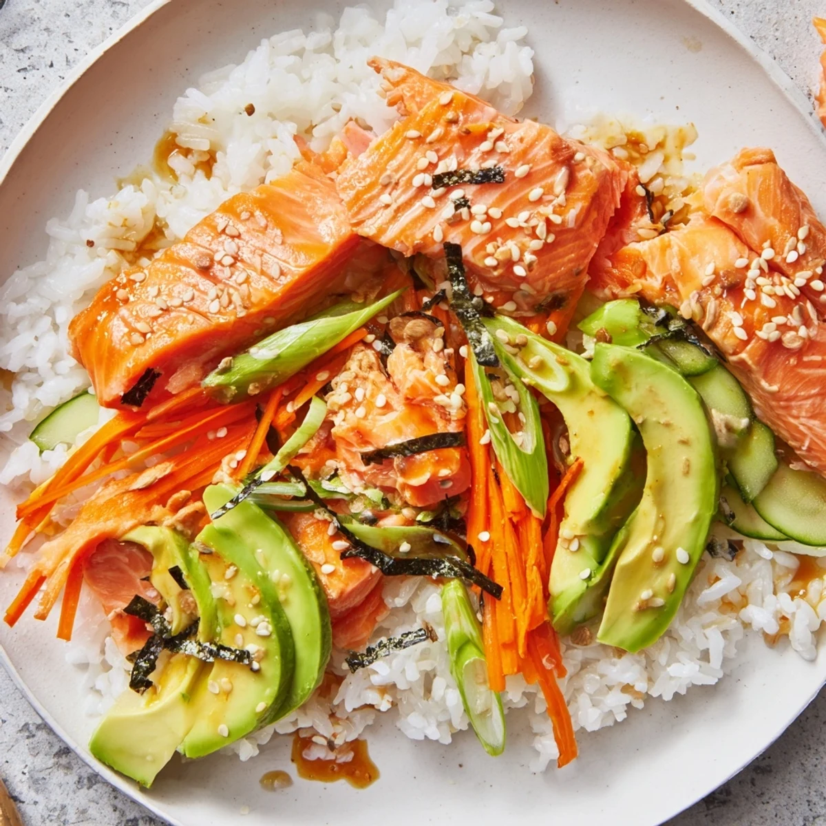 Japanese-Style Salmon & Chicken Rice Bowl with flaked salmon, juicy chicken, and vibrant toppings.