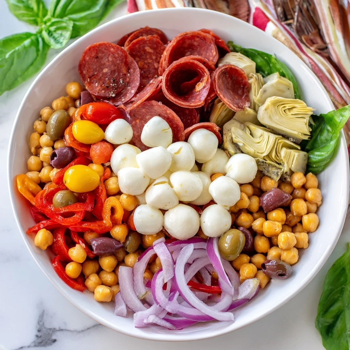 A close-up of delicious Antipasto chickpea salad, showcasing creamy mozzarella and hearty chickpeas.
