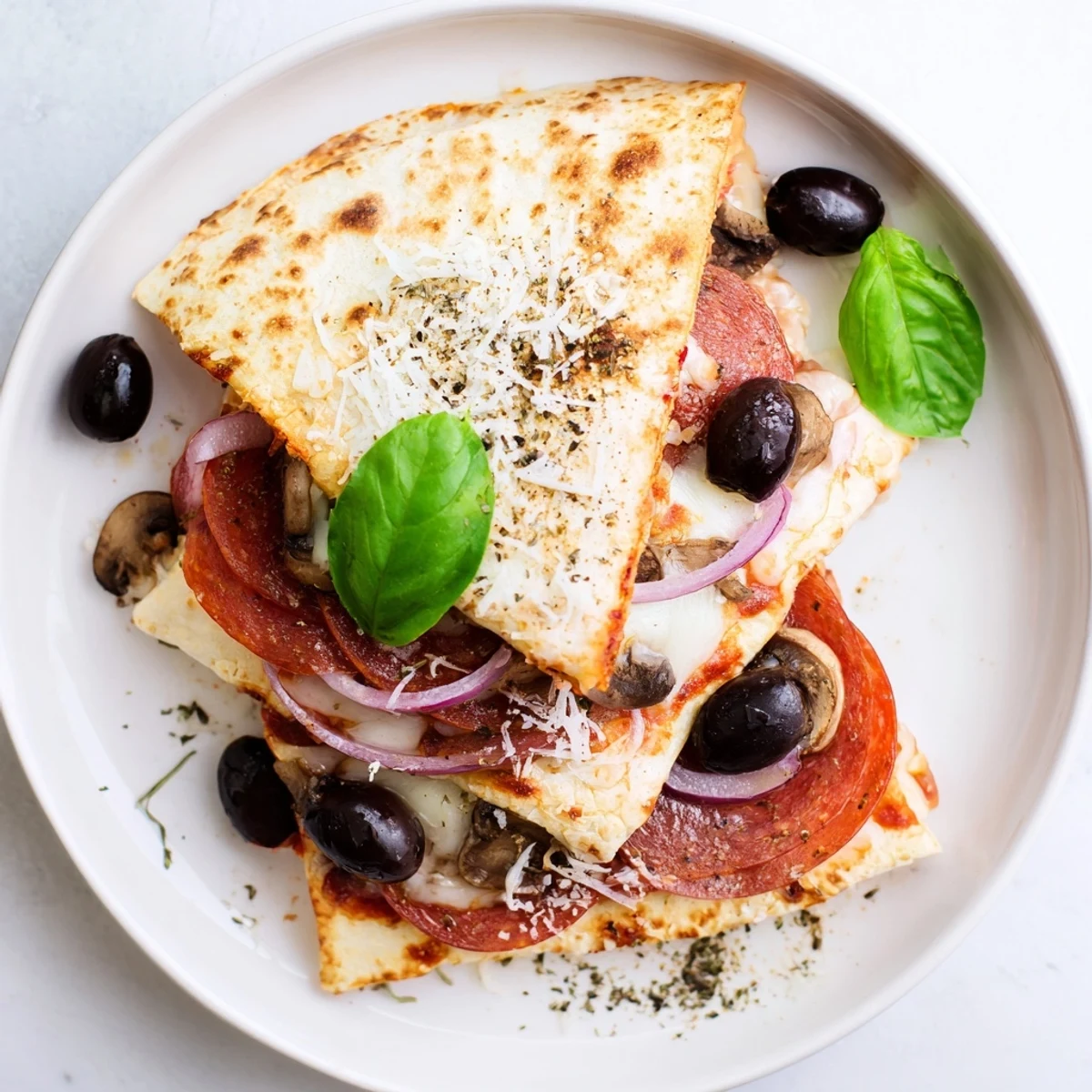 Golden, bubbly Cheesy Tortilla Pizza Wrap with melty mozzarella and pepperonis, ready to eat.