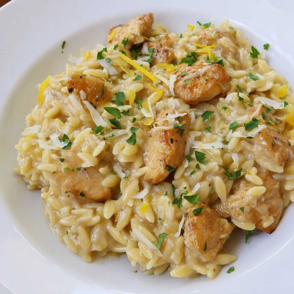 Bright, citrusy Creamy Lemon Chicken Orzo with Parmesan, a satisfying weeknight dinner idea.