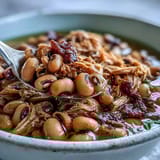 Crock-Pot Black-Eyed Peas with Smoked Turkey, tender peas and shredded turkey in rich, savory broth served over rice.