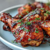 Sweet and spicy BBQ chicken drumsticks, perfectly glazed and ready to serve.