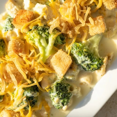 Creamy Chicken & Broccoli Cheddar Bake, bubbling golden brown, ready for serving tonight.