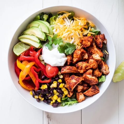Sheet Pan Chicken Burrito Bowls offer a flavorful Tex-Mex dinner, showcasing roasted chicken, colorful veggies.