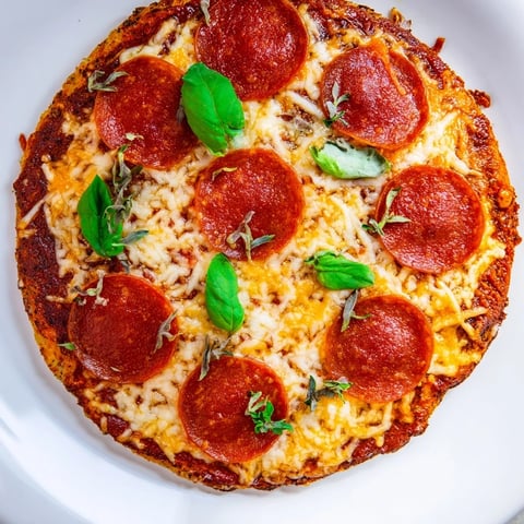 Golden and bubbly: a delicious Ground Beef Pizza Base topped with melted cheese and savory pepperoni.