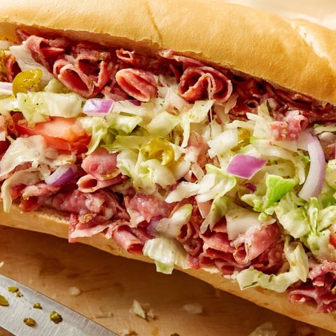 Toasted hoagie rolls stuffed with chopped salami, pepperoni, provolone, and crisp lettuce tossed in zesty Italian dressing.