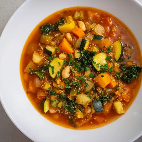 Hearty Minestrone with Quinoa, a vibrant vegetarian soup, perfect for a cold winter night meal.