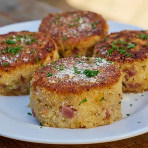 Savory and satisfying, these homemade Depression-Era Ham & Potato Patties feature flecks of ham and onion.