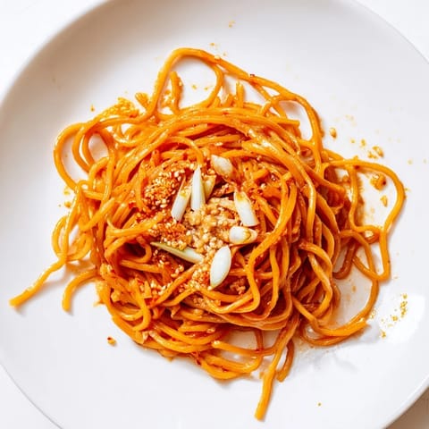 These flavorful Garlic Chili Oil Noodles are coated in a vibrant, glossy, spicy sauce.