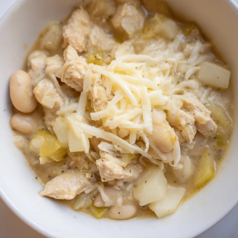 Homemade 35-minute white cheddar apple chicken chili, perfect for a quick, flavorful weeknight meal.