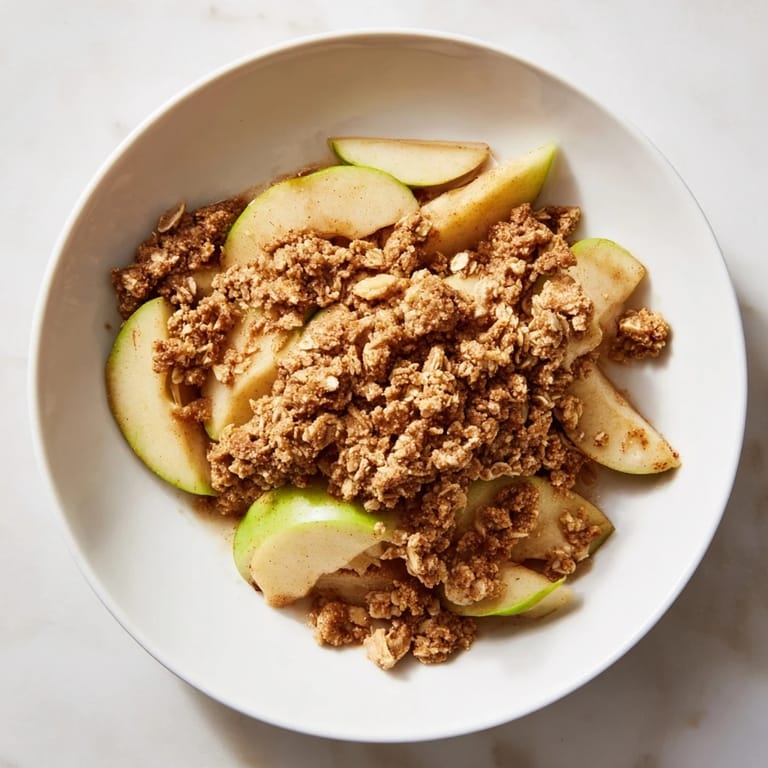 Bubbling Best Apple Crisp, a delicious autumn dessert with cinnamon-spiced apples beneath a crunchy topping.
